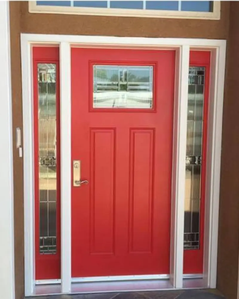 Red entry door with decorative sidelites