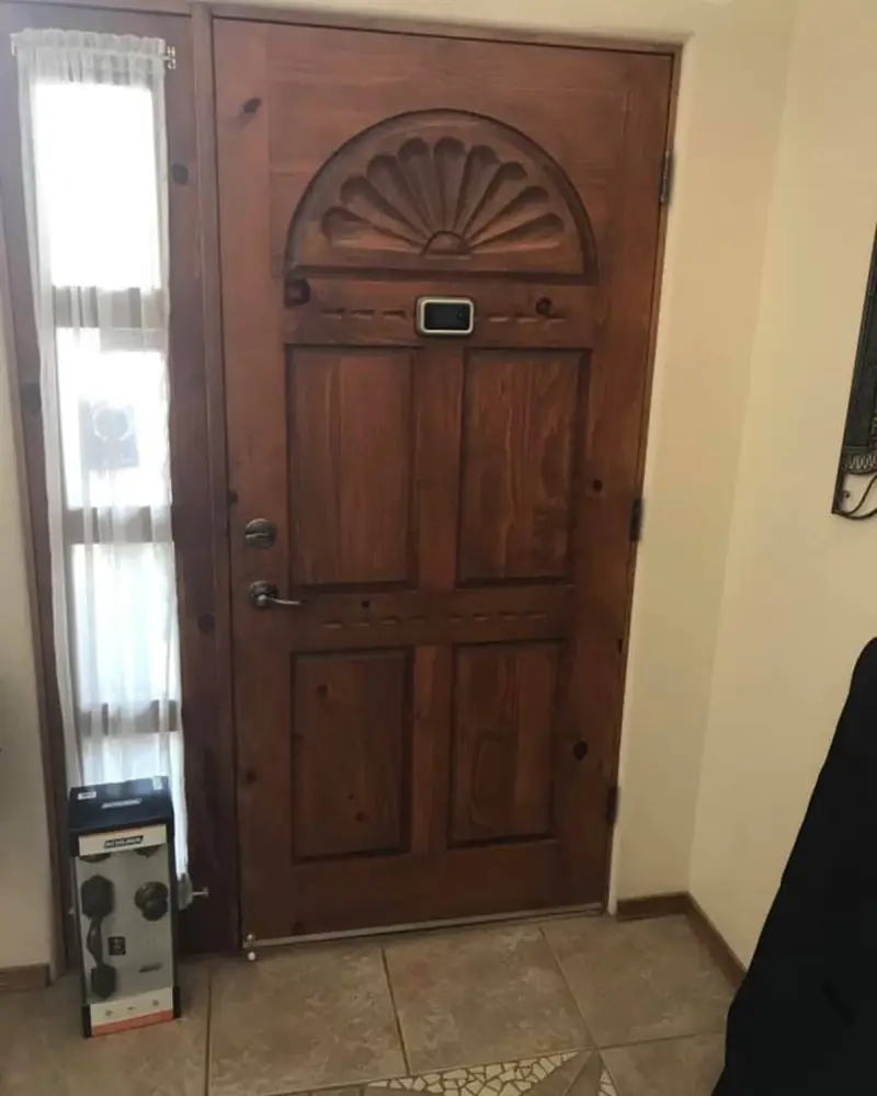 Knotty alder entry with carved fan detail
