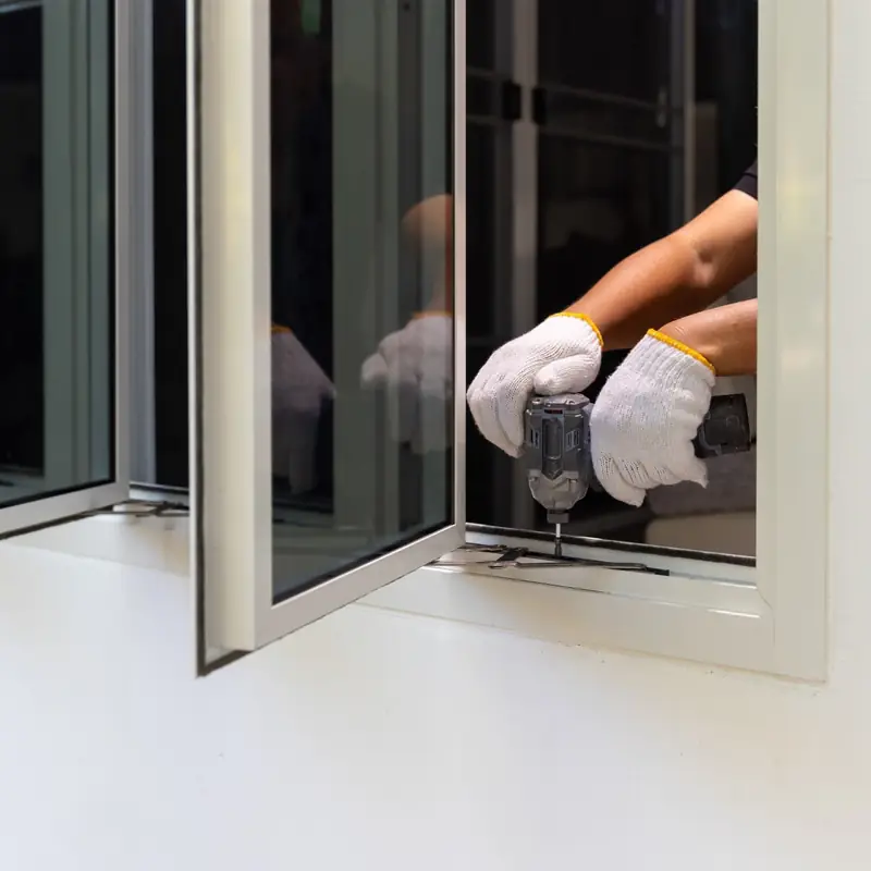 Window being fitted into its frame