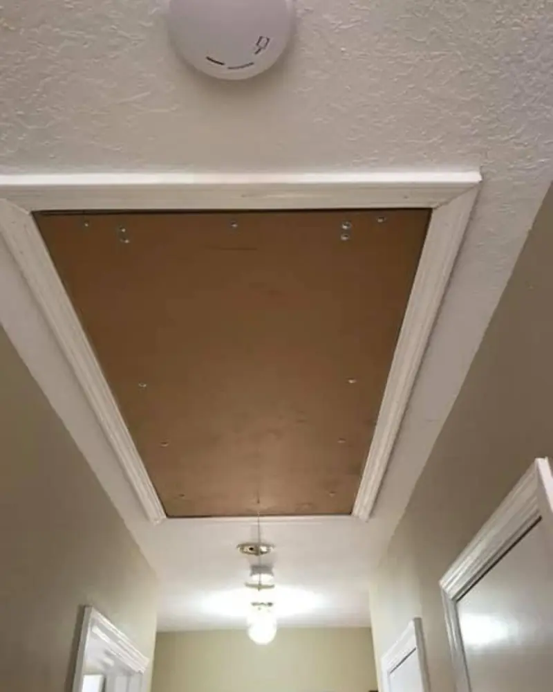 Attic access opening trimmed clean