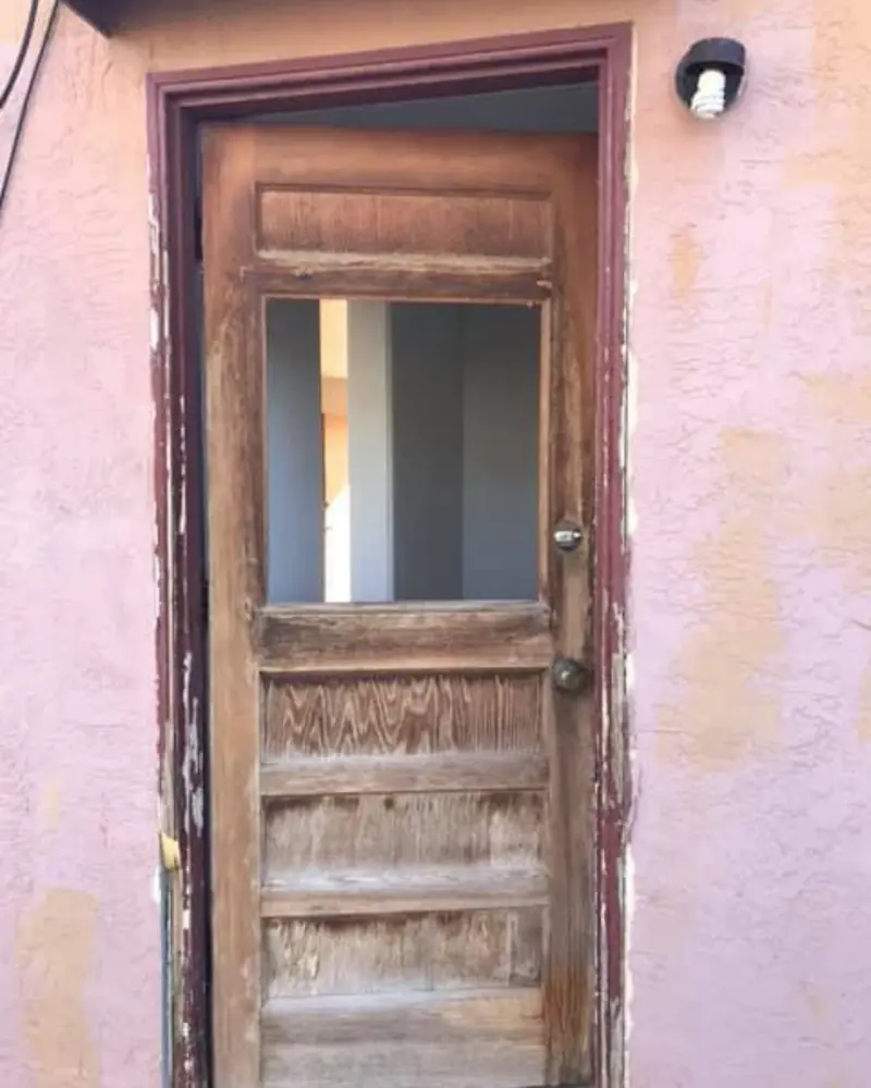 Weathered old door ready to be removed and replaced in Albuquerque